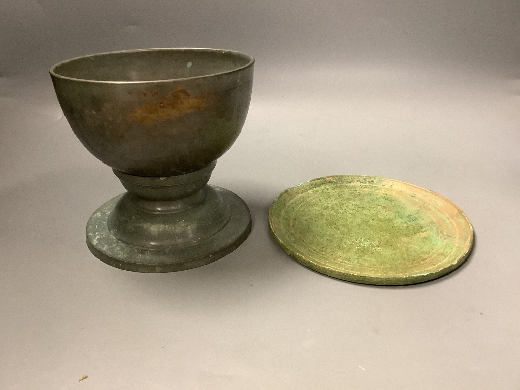 A Cambodian bronze ritual water bowl and stand and a similar mirror, Khmer, 12th/13th century